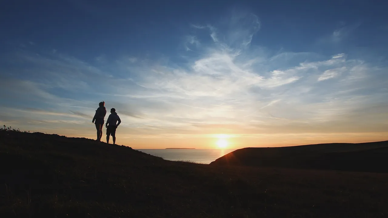 Walking along the hilly coastline — warm lifestyle scene